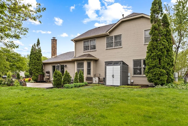 1185 Surrey Ln, Itasca, IL 60143 - back of property featuring a patio area and a chimney
