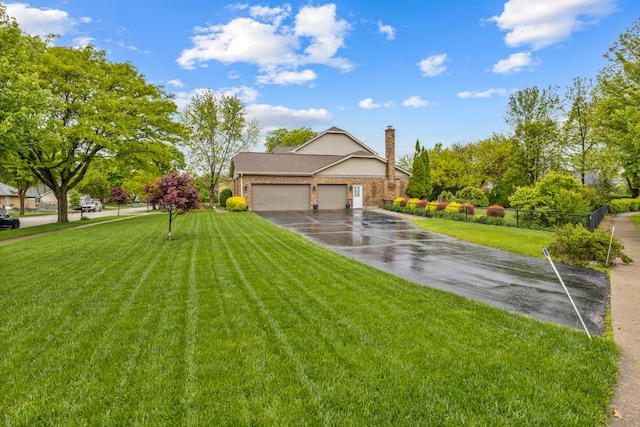 1185 Surrey Ln, Itasca, IL 60143 - view of front of property with asphalt driveway, a garage, a front yard, and a chimney