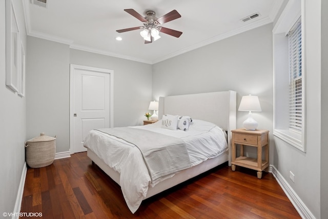 bedroom featuring baseboards, ceiling fan, ornamental molding, wood finished floors, and recessed lighting