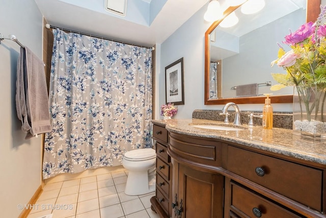 full bath featuring vanity, a shower with shower curtain, tile patterned flooring, and toilet