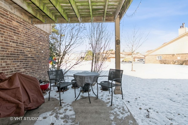 view of snow covered patio