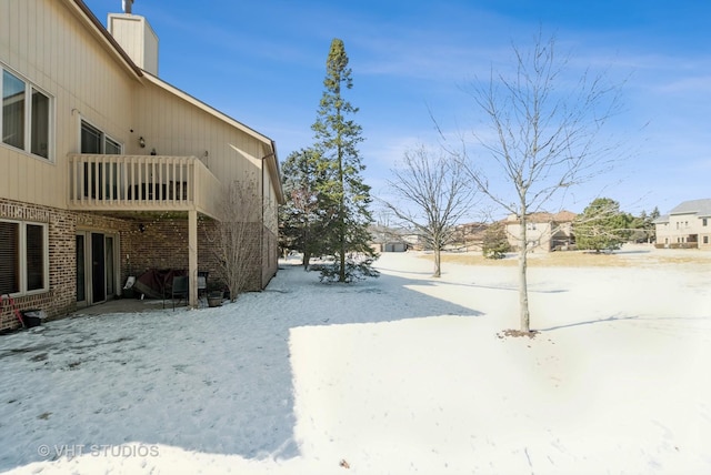 view of yard layered in snow