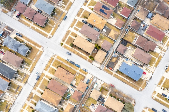 birds eye view of property with a residential view