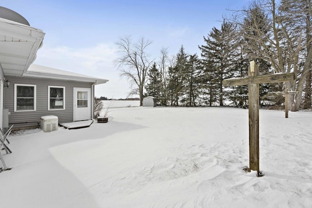 view of yard covered in snow