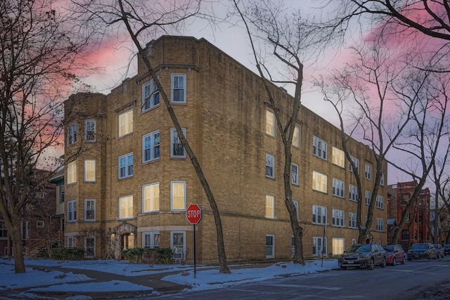 view of outdoor building at dusk