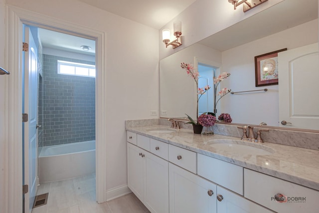 full bathroom featuring double vanity, shower / washtub combination, a sink, and visible vents