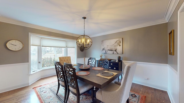 7N108 Hastings Dr, Saint Charles, IL 60175 - dining area with a chandelier, light wood-style floors, ornamental molding, and baseboards