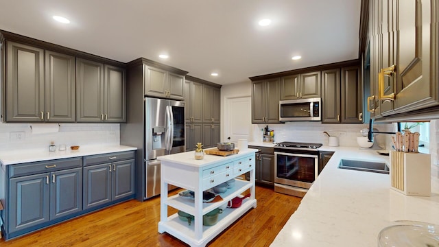 7N108 Hastings Dr, Saint Charles, IL 60175 - kitchen with stainless steel appliances, open shelves, decorative backsplash, light wood-type flooring, and recessed lighting