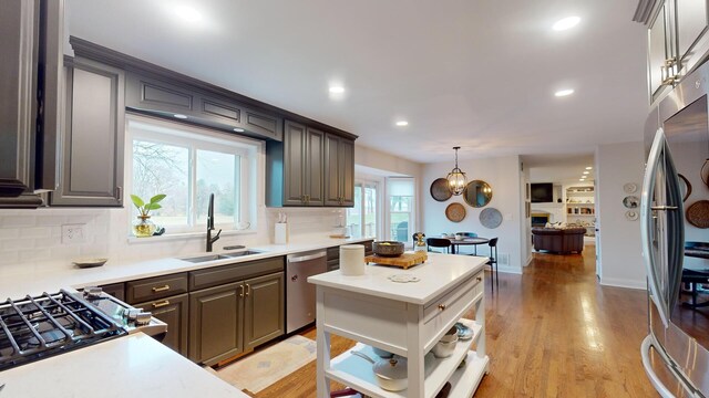 7N108 Hastings Dr, Saint Charles, IL 60175 - kitchen with stainless steel appliances, a sink, backsplash, recessed lighting, and light countertops