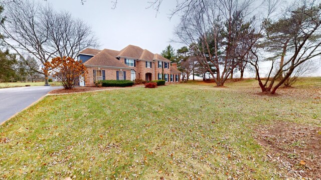 7N108 Hastings Dr, Saint Charles, IL 60175 - colonial-style house with a front yard and brick siding