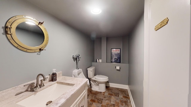 7N108 Hastings Dr, Saint Charles, IL 60175 - half bathroom featuring stone finish flooring, toilet, vanity, and baseboards