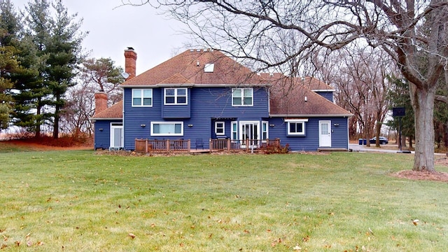 7N108 Hastings Dr, Saint Charles, IL 60175 - rear view of house with a chimney, a lawn, and a deck