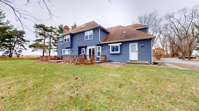 7N108 Hastings Dr, Saint Charles, IL 60175 - back of house featuring a chimney, a yard, a deck, and a shingled roof
