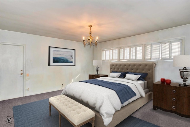 bedroom with a chandelier and carpet