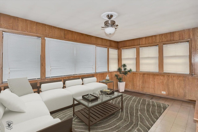 sunroom featuring ceiling fan