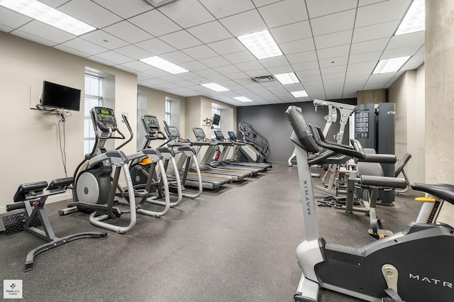 workout area featuring a paneled ceiling