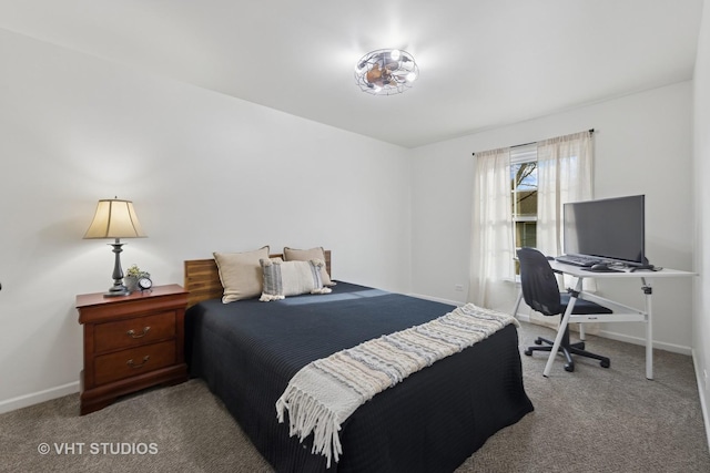 bedroom featuring carpet and baseboards