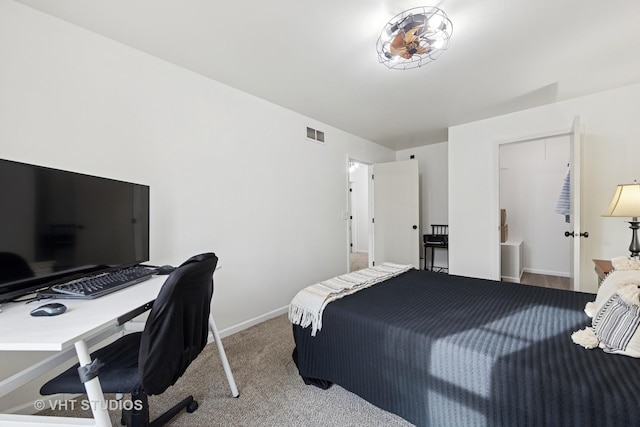 bedroom with carpet floors, baseboards, and visible vents