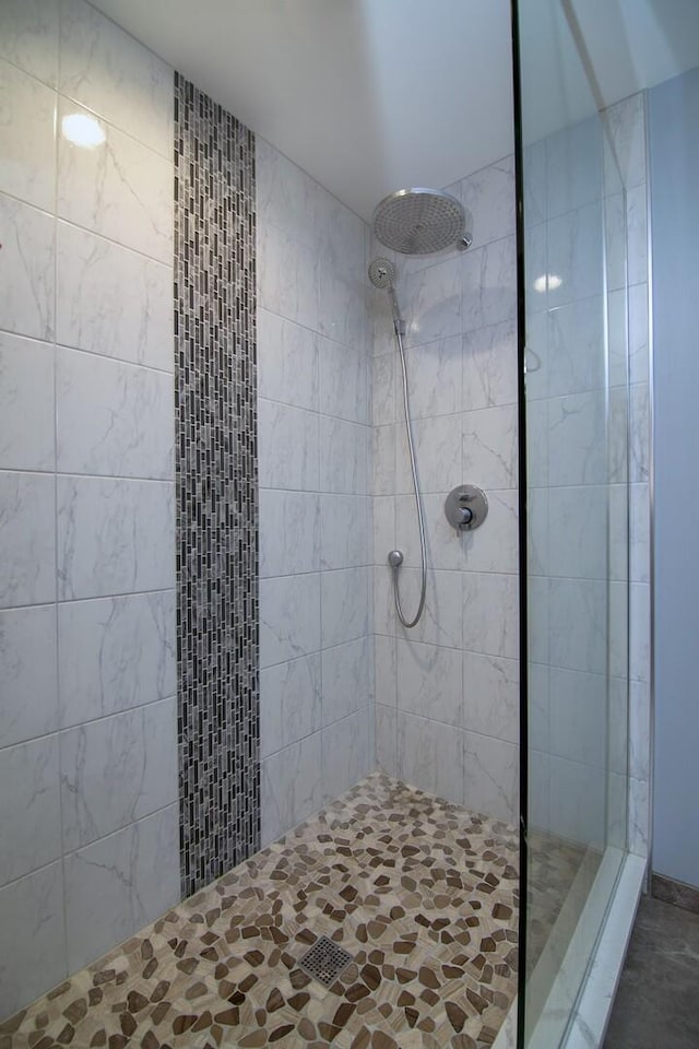 bathroom with a tile shower