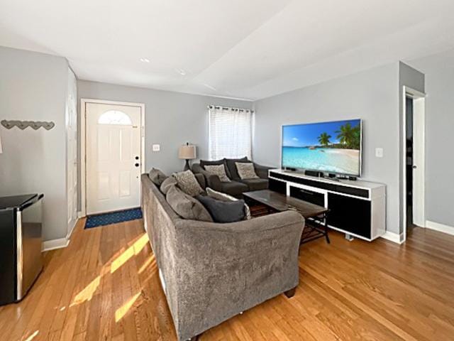 living area featuring wood finished floors and baseboards