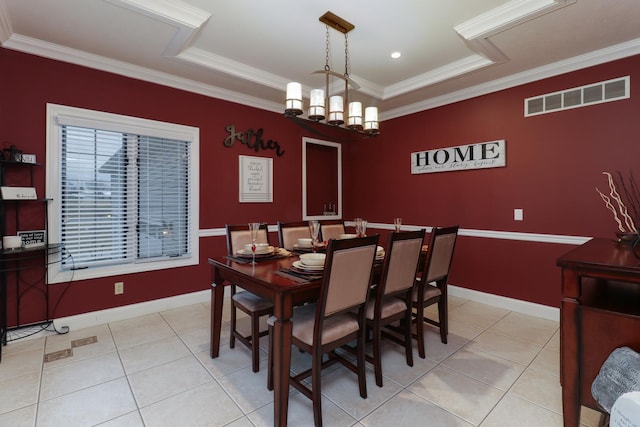 dining room featuring an inviting chandelier, light tile patterned flooring, visible vents, and ornamental molding