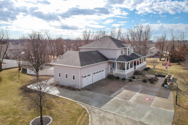 exterior space with driveway, roof with shingles, an attached garage, and a front yard