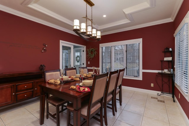 dining area featuring light tile patterned floors, baseboards, a chandelier, and crown molding