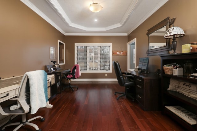 office featuring ornamental molding, a tray ceiling, wood-type flooring, and baseboards