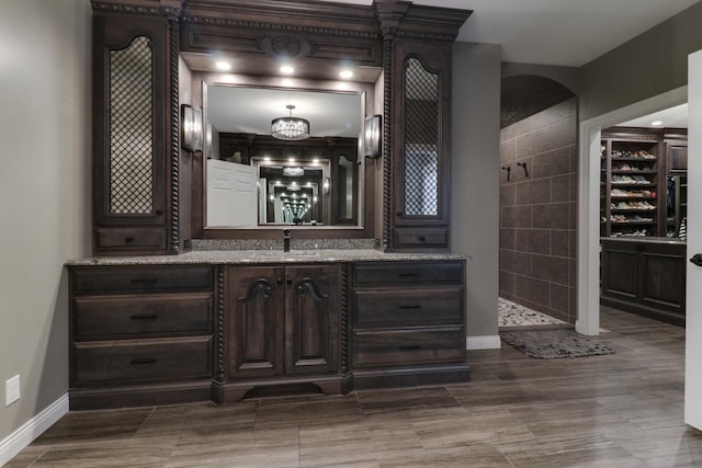 bar featuring a sink and baseboards