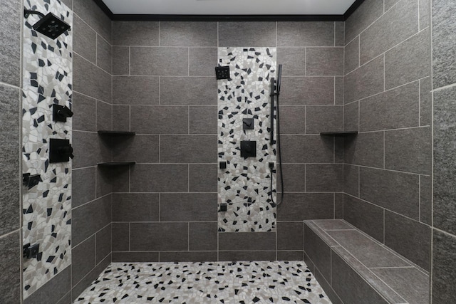 bathroom featuring tiled shower