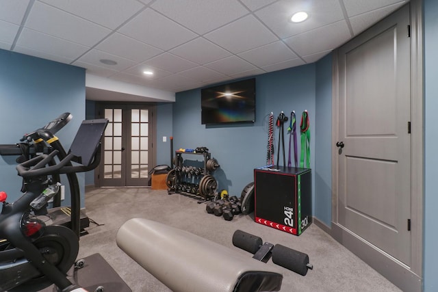 workout room with a drop ceiling, recessed lighting, carpet floors, baseboards, and french doors