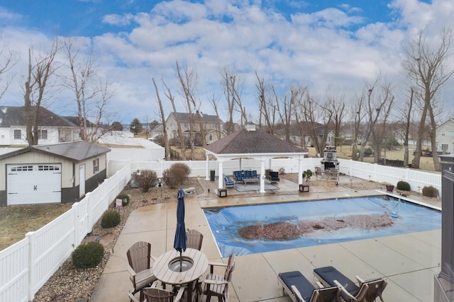 view of pool featuring a fenced in pool, a residential view, a fenced backyard, and a gazebo