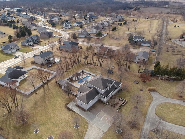 birds eye view of property with a residential view