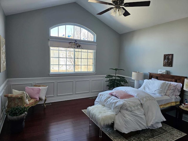 bedroom with ceiling fan, lofted ceiling, and dark hardwood / wood-style flooring