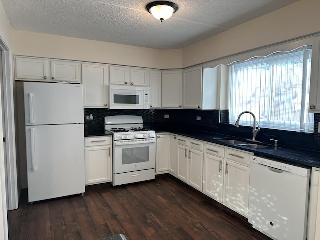 kitchen featuring white cabinetry, sink, white appliances, and dark hardwood / wood-style flooring