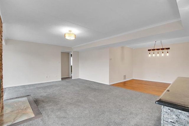 unfurnished living room featuring carpet flooring