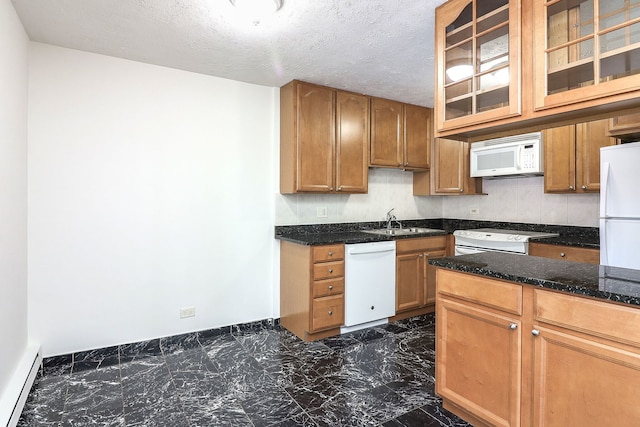 kitchen featuring sink, white appliances, a textured ceiling, a baseboard radiator, and dark stone counters