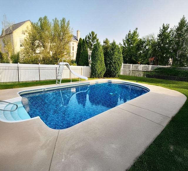 view of pool featuring a patio area, a fenced backyard, a fenced in pool, and a water slide