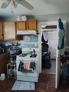 11737 S Yale Ave, Chicago, IL 60628 - kitchen featuring gas range gas stove, under cabinet range hood, a ceiling fan, and brown cabinets