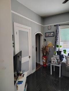 11737 S Yale Ave, Chicago, IL 60628 - foyer with arched walkways, wood finished floors, and ceiling fan