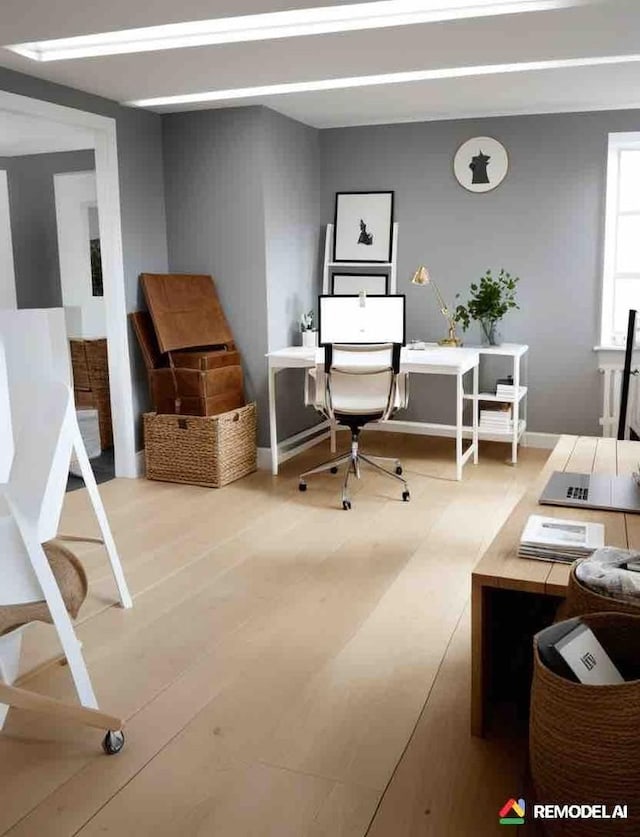 office area featuring baseboards and wood finished floors