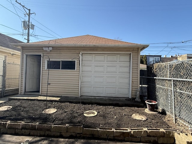 garage with fence