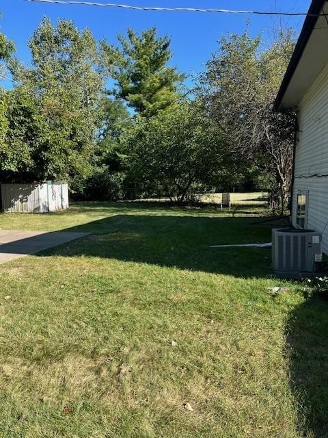 view of yard featuring central AC