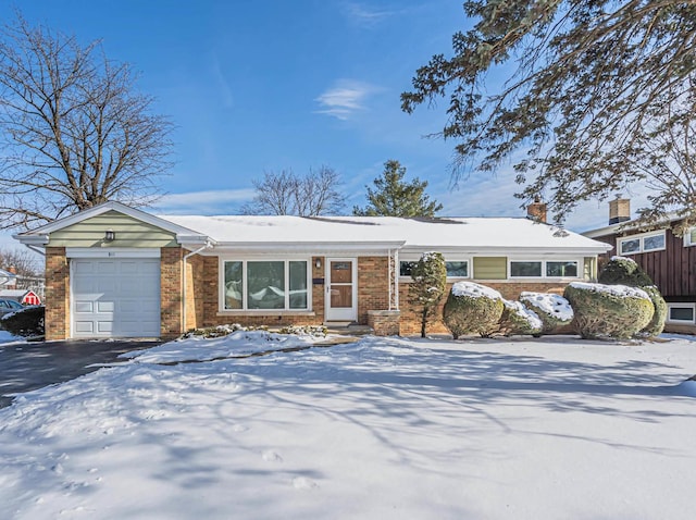 ranch-style home with a garage