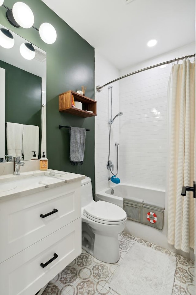 bathroom with toilet, tile patterned flooring, shower / bath combination with curtain, and vanity