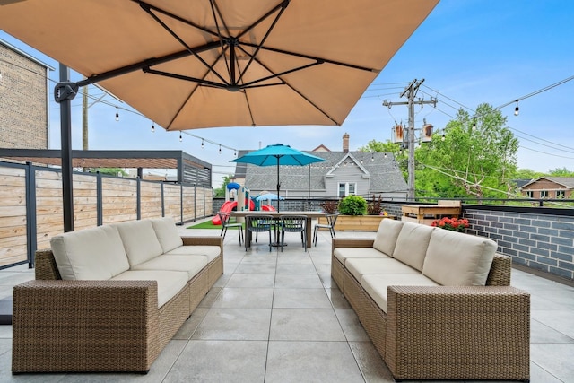 view of patio / terrace featuring outdoor dining area, fence, and outdoor lounge area