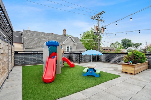 view of play area featuring a patio area