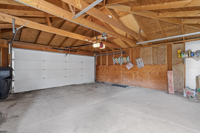 garage featuring a garage door opener