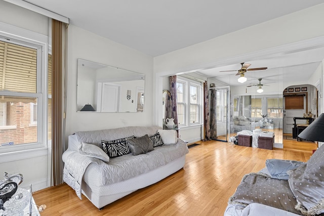 living area featuring baseboards and wood finished floors