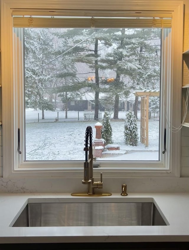 room details with light countertops and a sink